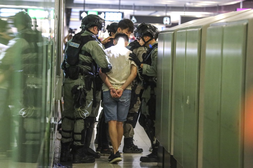 Riot police arrest a suspect at Hong Kong’s Central MTR Station. Photo: Dickson Lee
