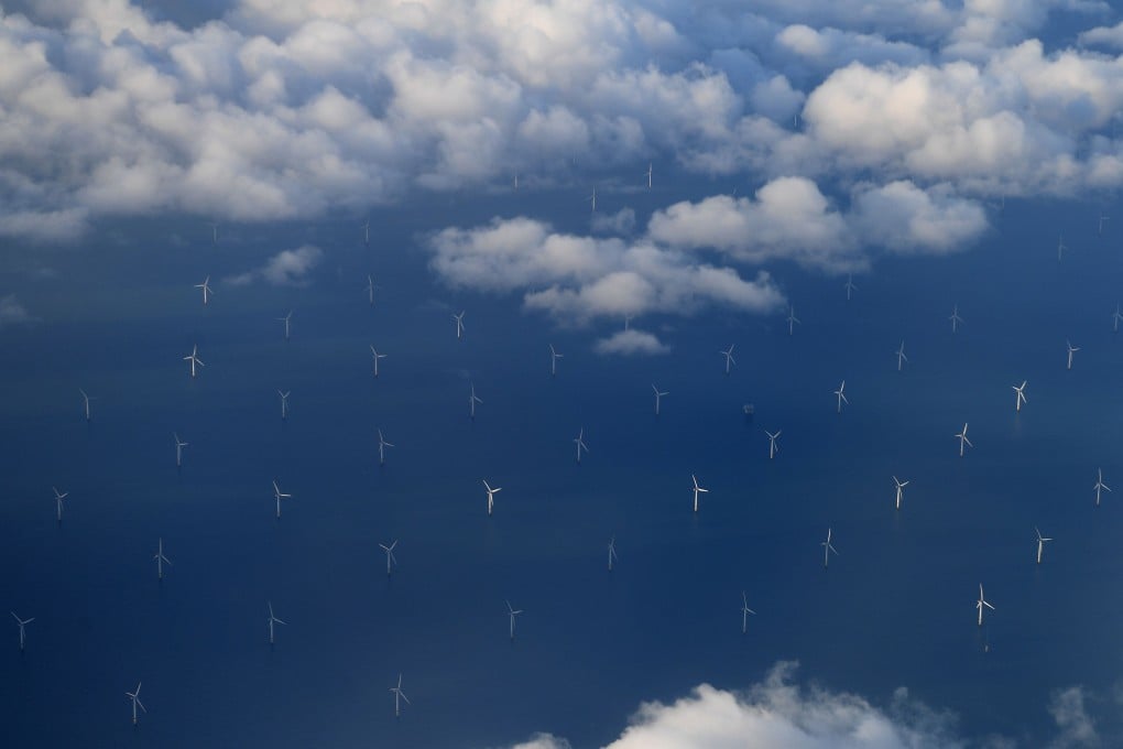 The Burbo Bank Offshore Wind Farm on the Burbo Flats in Liverpool Bay, England, is seen from a plane window. Renewables like wind and solar power can dramatically reduce – by as much as 50 per cent – the carbon dioxide emissions from electricity generation by 2030. Photo: AFP