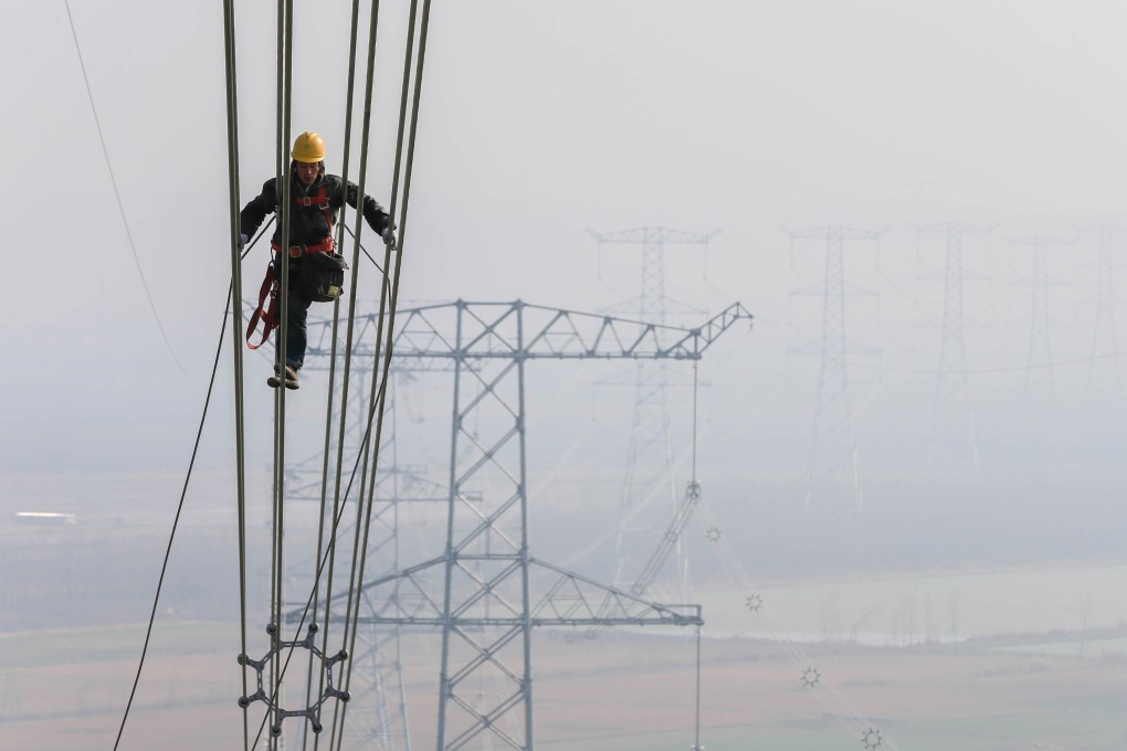 A technician examines the transmission line on an ultra-high voltage system in Huaian, Jiangsu province, in 2015. State Grid’s internet technologies project is another part of its plan to upgrade China’s power infrastructure. Photo: Xinhua