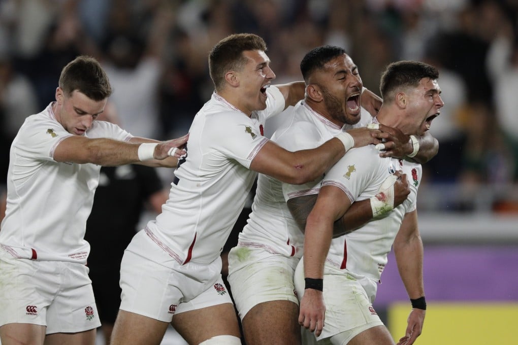 England celebrate scoring a try against New Zealand at International Yokohama Stadium. Photo: AP
