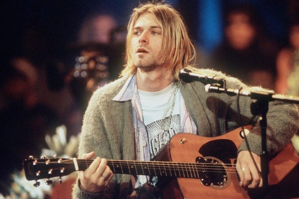 web限定セール Kurt Cobain's iconic cigarette-burned sweater sells for トップス