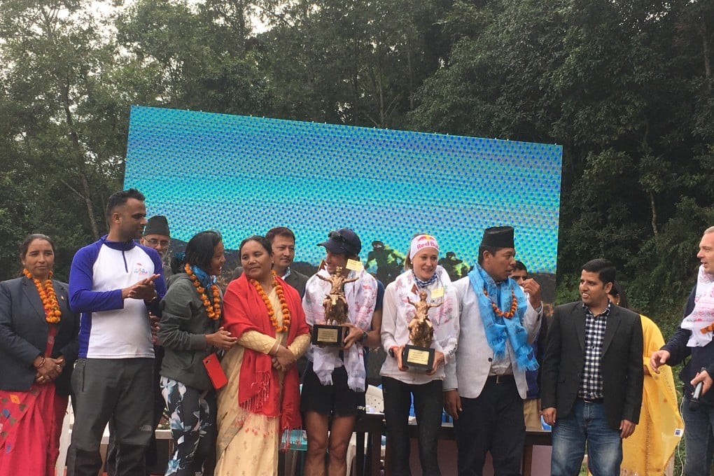 Kilian Jornet and Judith Wyder receive their Golden Trails trophies. Photo: Mark Agnew