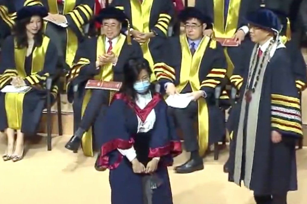 A mask-wearing student leaves the stage of Hong Kong Polytechnic University during the annual degree-awarding ceremony on Sunday. Photo: Handout