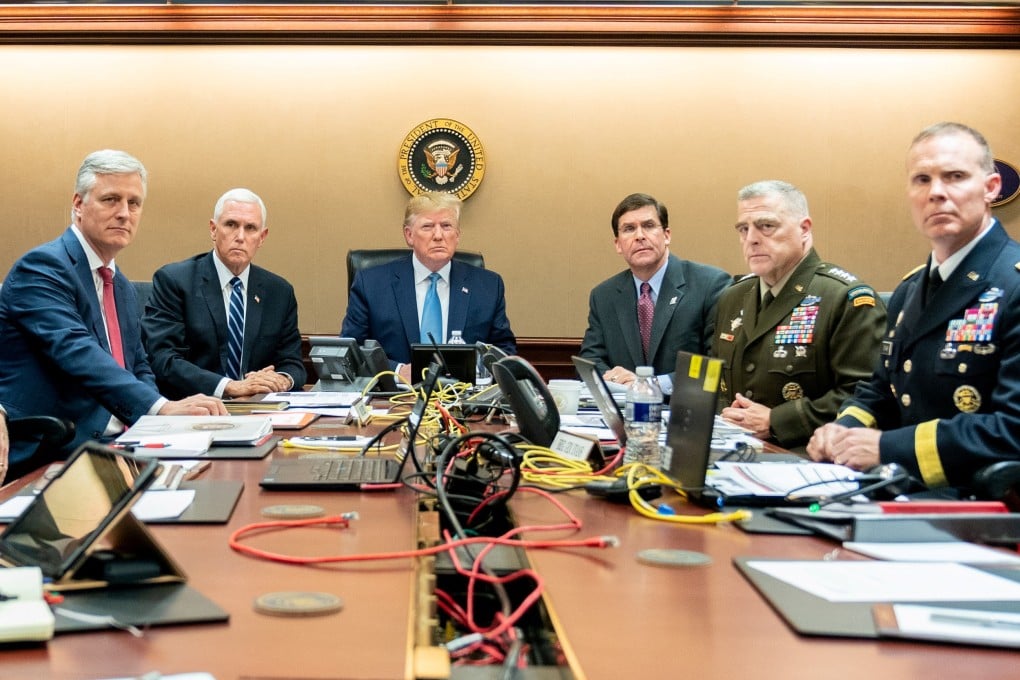 The Donald Trump photo, with the president in the centre and looking severe, is more formal and captures the current president’s interest in conveying the power and grandeur of his office. Photo: Reuters