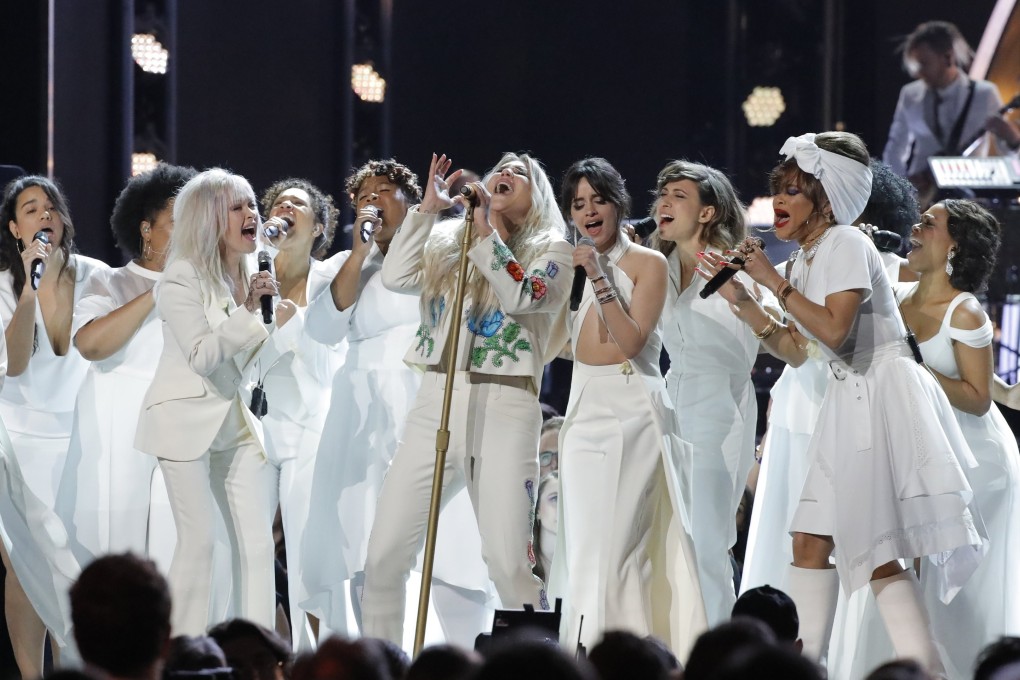 Kesha (centre), who levelled accusations of sexual assault against producer Dr Luke, is joined by a multitude of singers as they perform Praying at the Grammy Awards. Photo: Reuters/Lucas Jackson