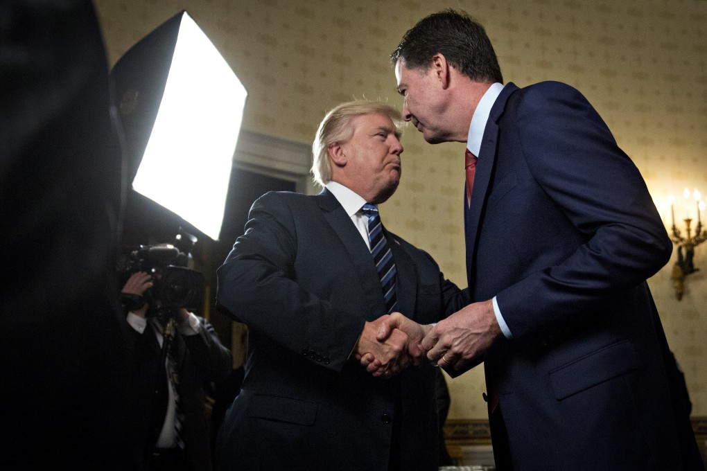 Donald Trump with James Comey. Photo: EPA