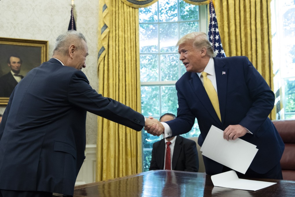 Chinese Vice-Premier Liu He shakes hands with US President Donald Trump in the White House in Washington on October 11. Photo: EPA-EFE