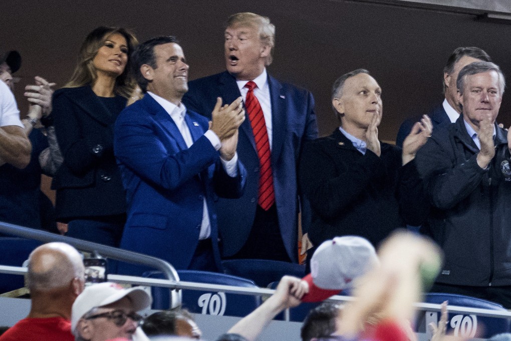 US President Donald Trump (centre), first lady Melania Trump and Republican lawmakers react as the stadium boos when the president is shown on the jumbo screen at the World Series game at Nationals Park in Washington on Sunday. Photo: AP
