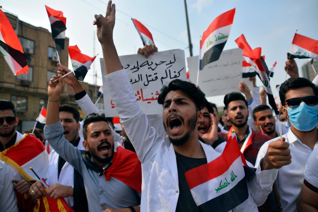 Iraqi medical students take part in an anti-government demonstration in the central holy shrine city of Najaf on Monday. Photo: AFP