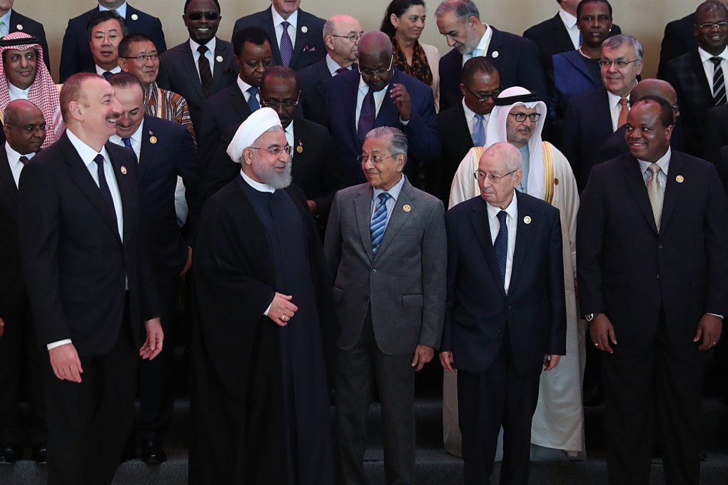 Malaysian Prime Minister Mahathir Mohamad with Iranian President Hassan Rowhani (centre) at the 18th Non-Aligned Movement Summit in Azerbaijan. Photo: Iranian Presidency/DPA