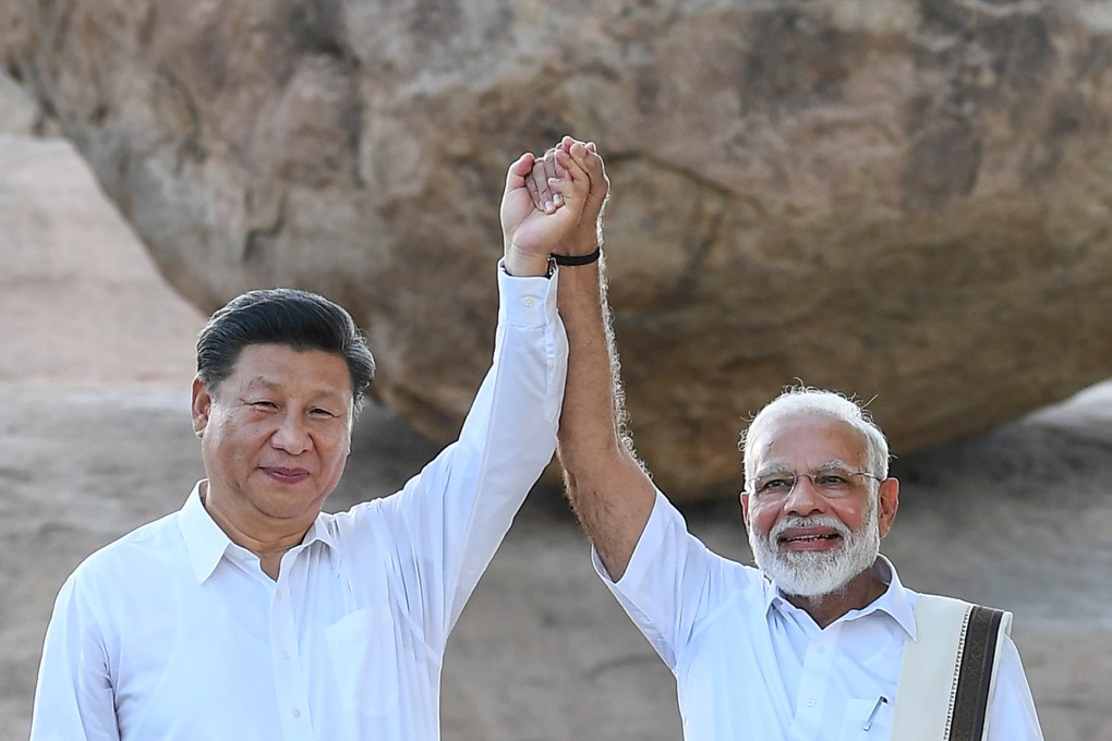 Chinese President Xi Jinping and Indian Prime Minister Narendra Modi visit the Vaan Irai Kal, or Krishna's Butterball, in Mamallapuram on October 11. Photo: PTI