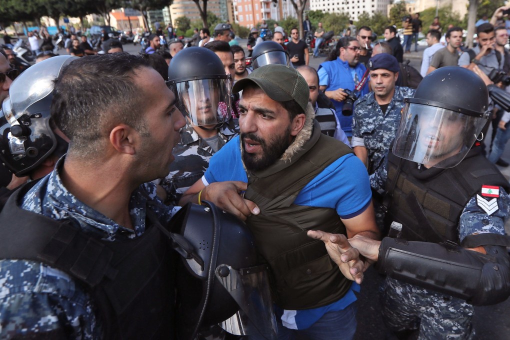 Lebanese security forces contain clashes between demonstrators and counterprotesters in the centre of Beirut on Tuesday. Photo: AFP