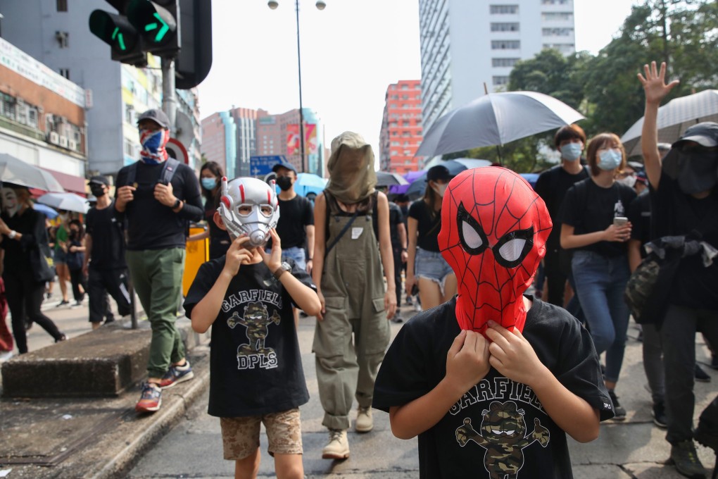 Young protesters wearing superhero masks join an anti-government rally in Jordan on October 20. A ban on face masks at public gatherings in Hong Kong took effect at midnight on October 4. on Photo: Winson Wong