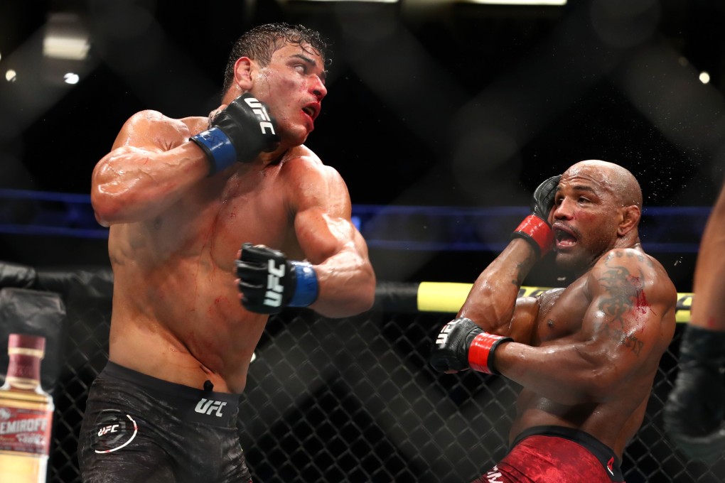 Paulo Costa throws a punch at Yoel Romero at UFC 241. Photo: AFP