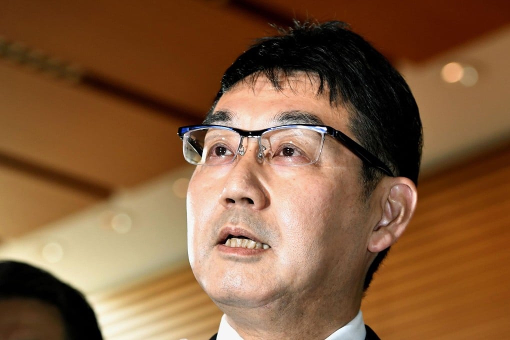 Former Japanese justice minister Katsuyuki Kawai speaks to reporters after submitting his resignation to Prime Minister Shinzo Abe. Photo: Kyodo
