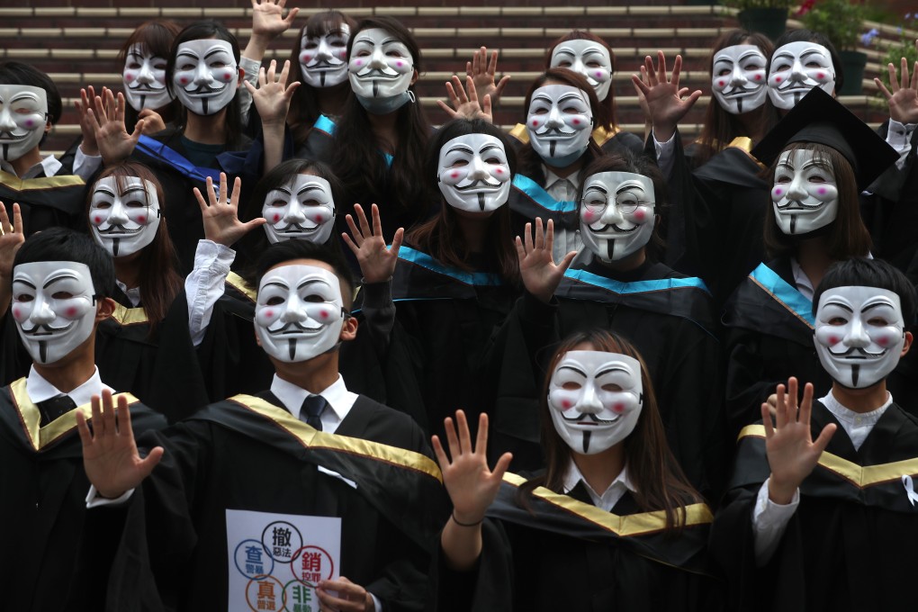 Hong Kong Polytechnic University graduates holding up five fingers in reference to ‘five key demands, not one less’, during a flash mob protest. Photo: Sam Tsang