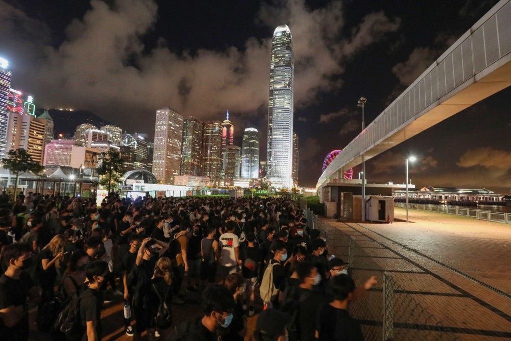 Protesters rally at the Central harbourfront site which the government will give to the PLA. Photo: Dickson Lee