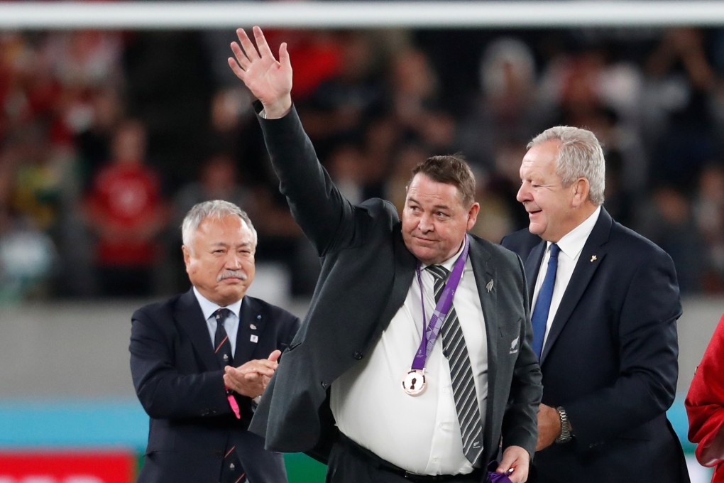New Zealand head coach Steve Hansen after receiving his bronze medal from Japan Rugby Football Union president Shigetaka Mori and World Rugby chairman Bill Beaumont. Photo: Reuters