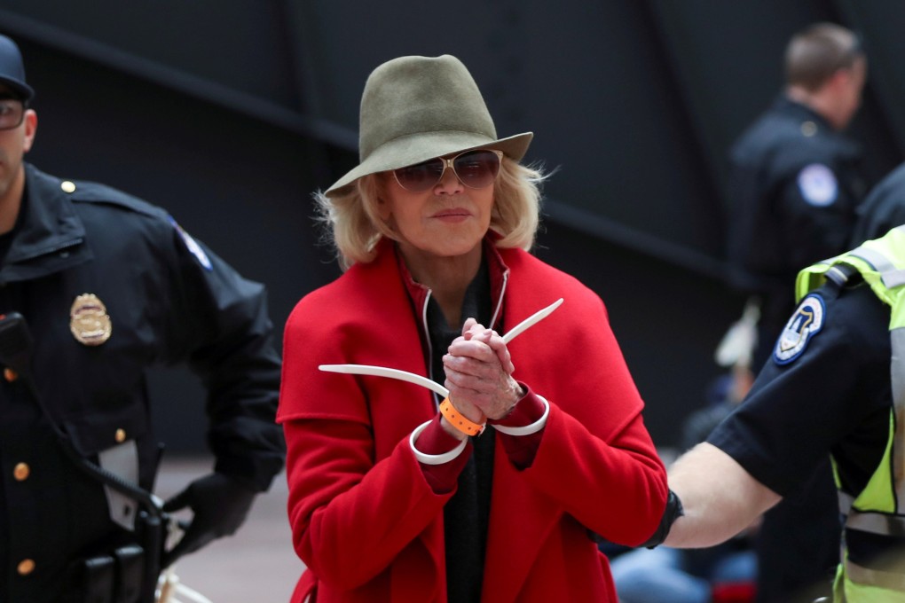 Actress Jane Fonda is arrested by US Capitol Police officers on Friday. Photo: Reuters