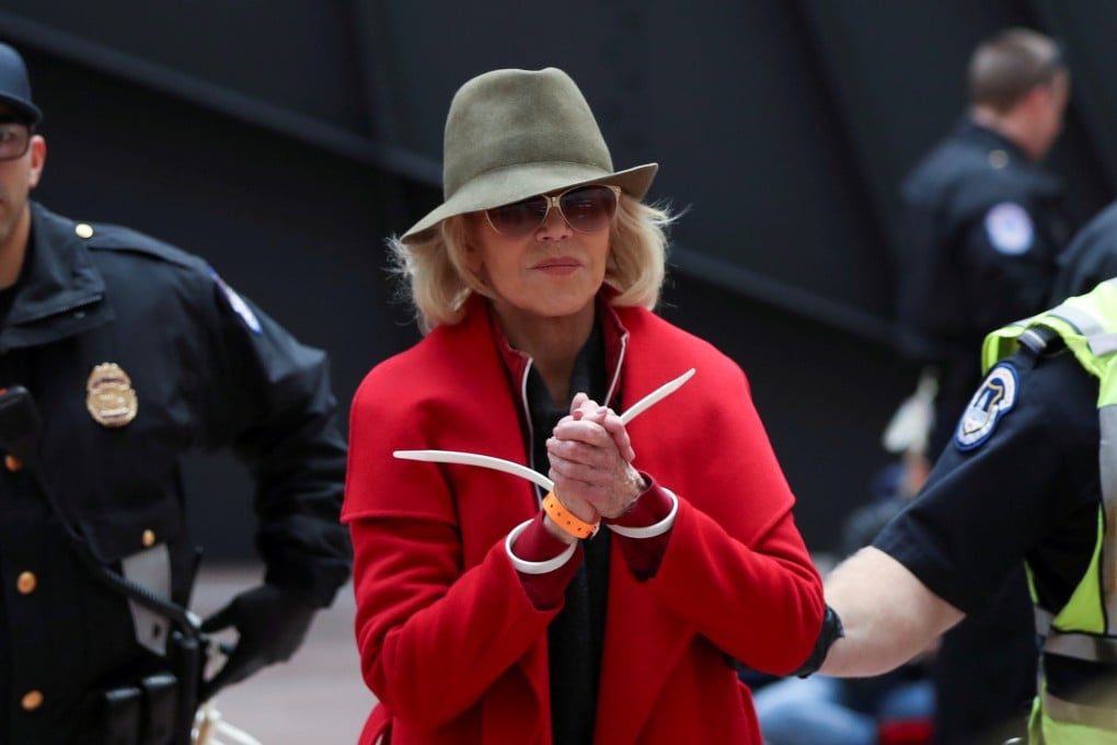 Actress Jane Fonda is arrested by US Capitol Police officers on Friday. Photo: Reuters