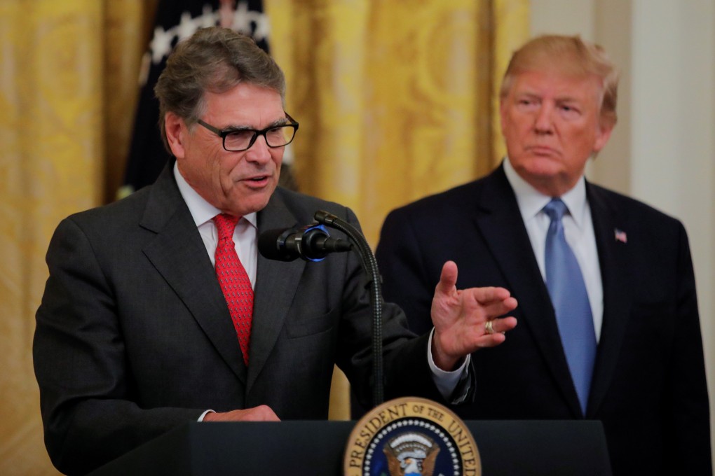 US President Donald Trump listens to Energy Secretary Rick Perry, left, speak. Photo: Reuters