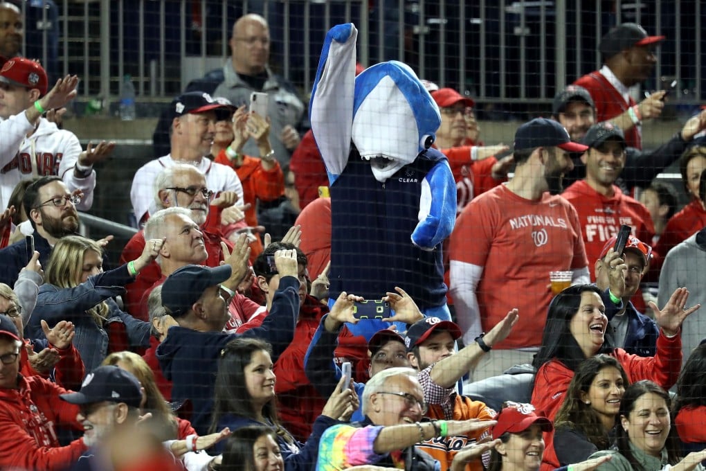 Fans take part in the Baby Shark song during Game Three of the 2019 World Series at Nationals Park on October 25. Photo: AFP