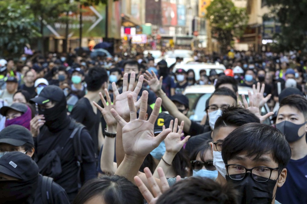 Protesters on Saturday afternoon head to Central Lawn in Victoria Park for what police said would be unauthorised rally. Photo: Felix Wong