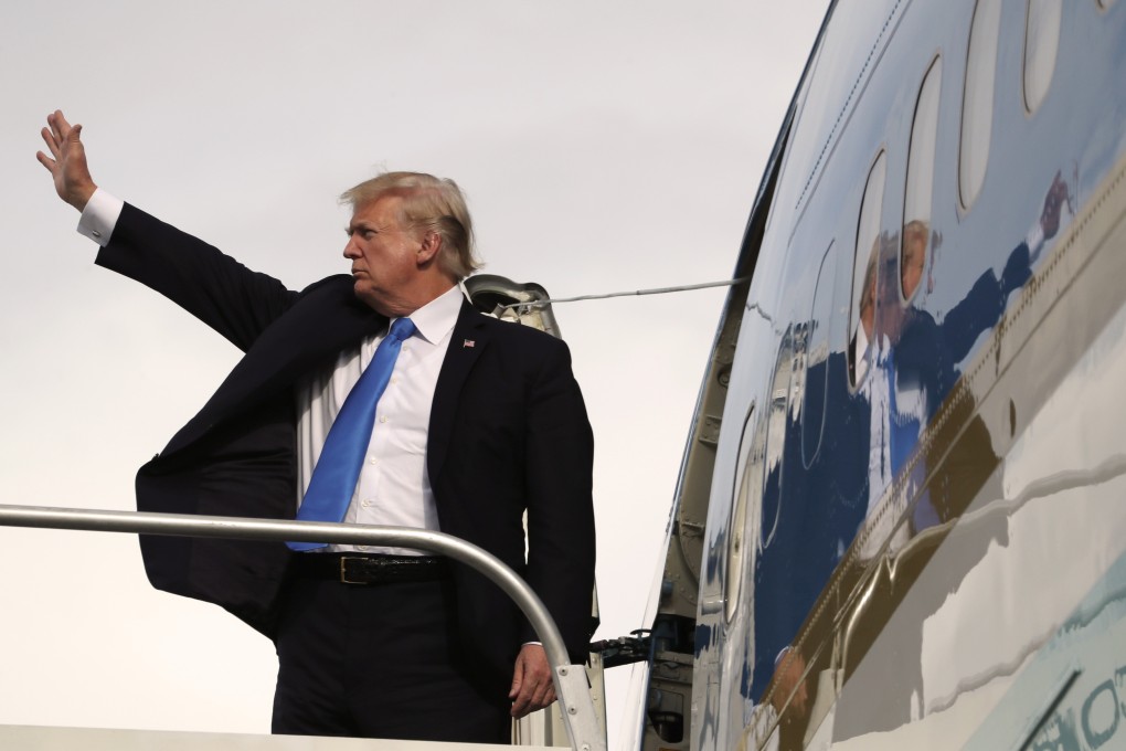 US President Donald Trump waves goodbye before entering Air Force One to leave Manila, in the Philippines, just hours before the East Asia Summit he had been expected to attend, on November 14, 2017. Analysts see this as a key moment in the decline of US influence in the Asia-Pacific. Photo: AP