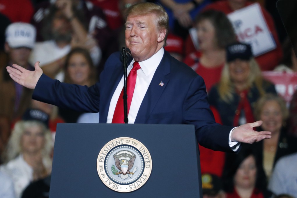 President Donald Trump gestures to the audience during his address in Tupelo on Friday. Photo: AP