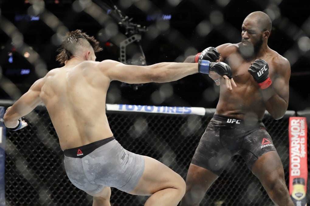 Corey Anderson knocks down Johnny Walker at UFC 244. Photo: AP