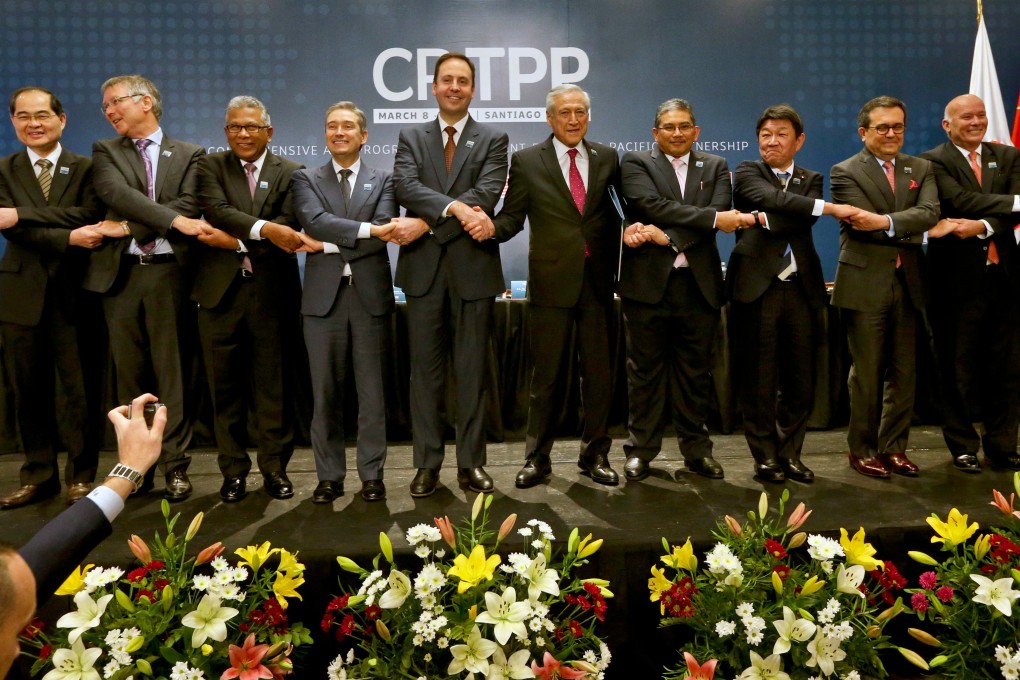 Ministers join hands after the signing ceremony of the Comprehensive and Progressive Agreement for Trans-Pacific Partnership in Santiago, Chile, in March 2018. Eleven countries formed the CPTPP after the US pulled out of Obama-led TPP. Photo: AP