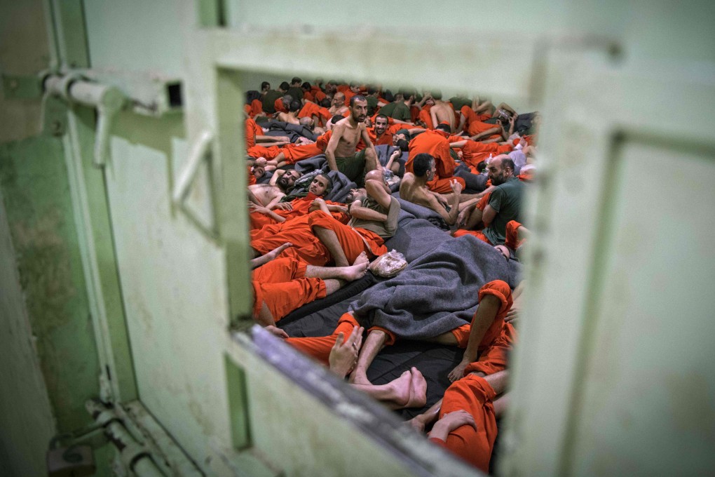 Men suspected of being affiliated with Islamic State gather in a prison cell in the northeastern Syrian city of Hasakah. Photo: AFP