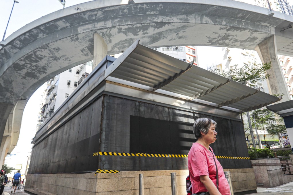 Temporary metal sheets cover glass panels at HKU station. Photo: Edmond So
