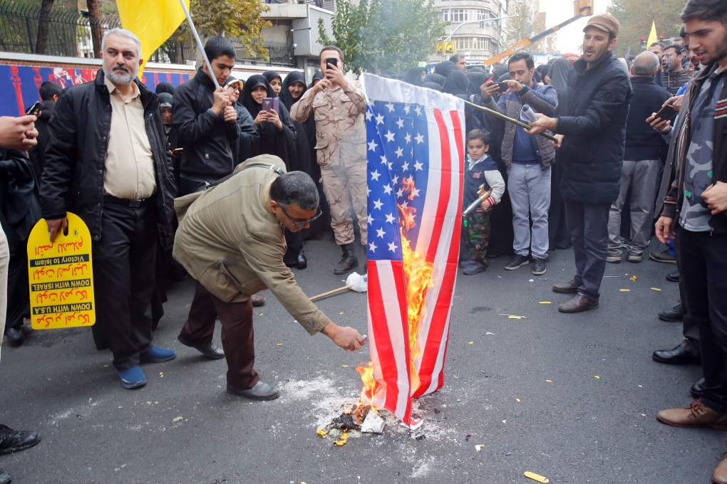 Iranians burn a US flag during an anti-US demonstration marking the 40th anniversary of the US embassy takeover in Tehran. Photo: EPA
