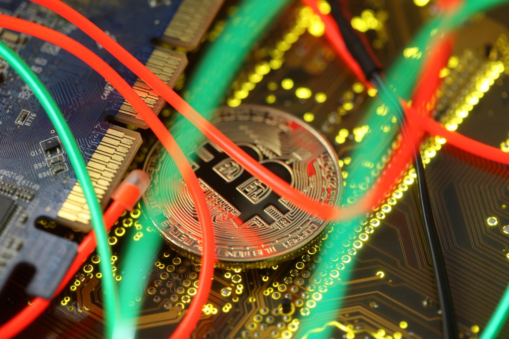 Representation of the Bitcoin virtual currency seen on a PC motherboard in this illustration picture. Photo: Reuters