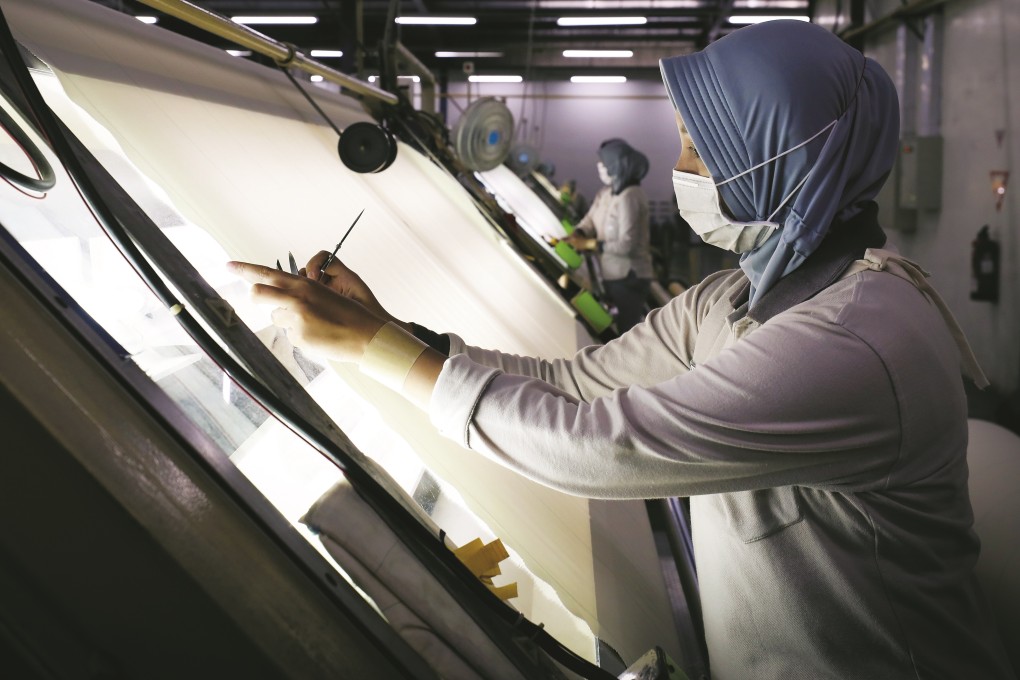 A worker at PT Moriuchi textile factory in West Java, Indonesia. Indonesia aims to be one of the world’s top five textile and apparel producers by 2030. Photo: James Wendlinger