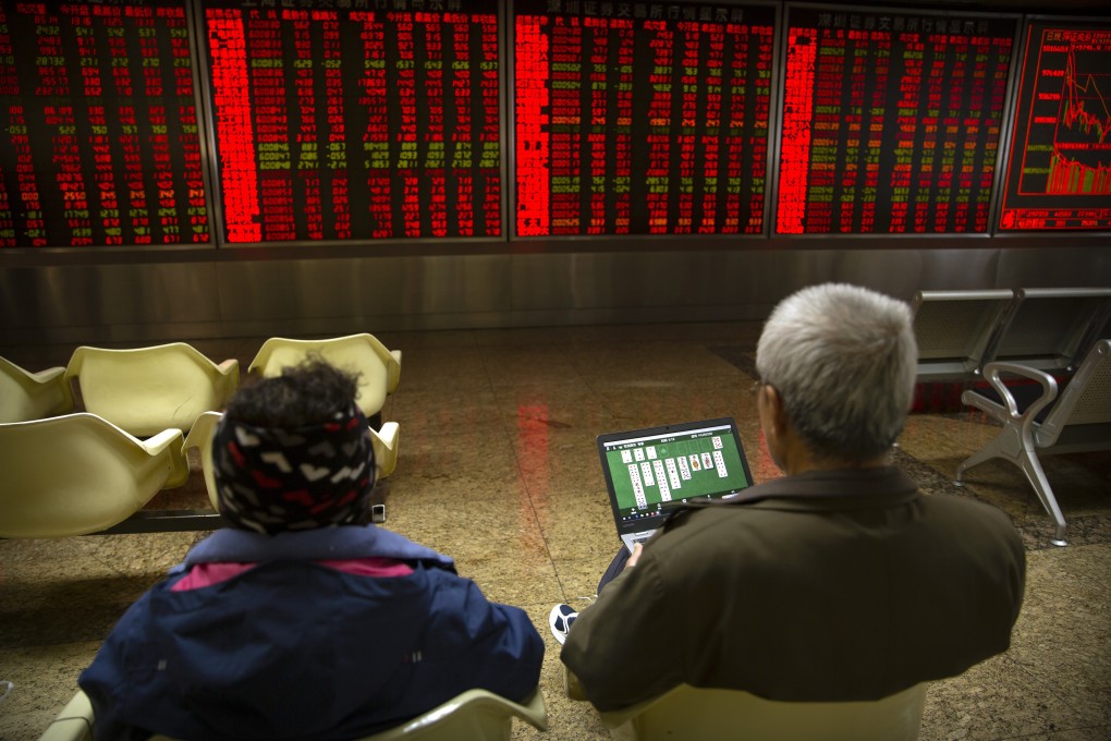 Chinese investors monitor stock prices at a brokerage house in Beijing on November 4, 2019. Photo: Associated Press
