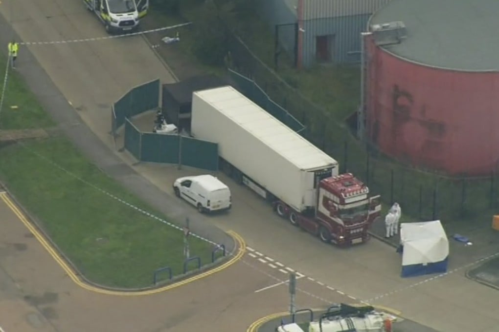 A police forensic team inspect the truck in which the 39 bodies were found on October 23. Photo: AP