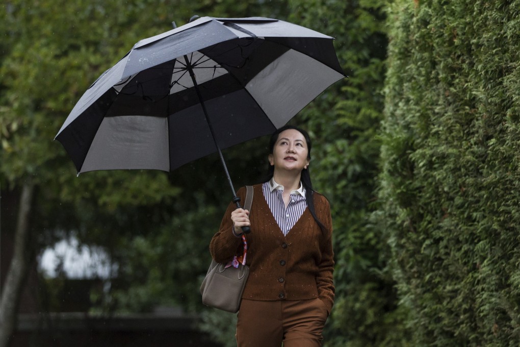 Huawei chief financial officer Meng Wanzhou carries an umbrella as she leaves her home to attend a court hearing in Vancouver in October. Photo: The Canadian Press via AP