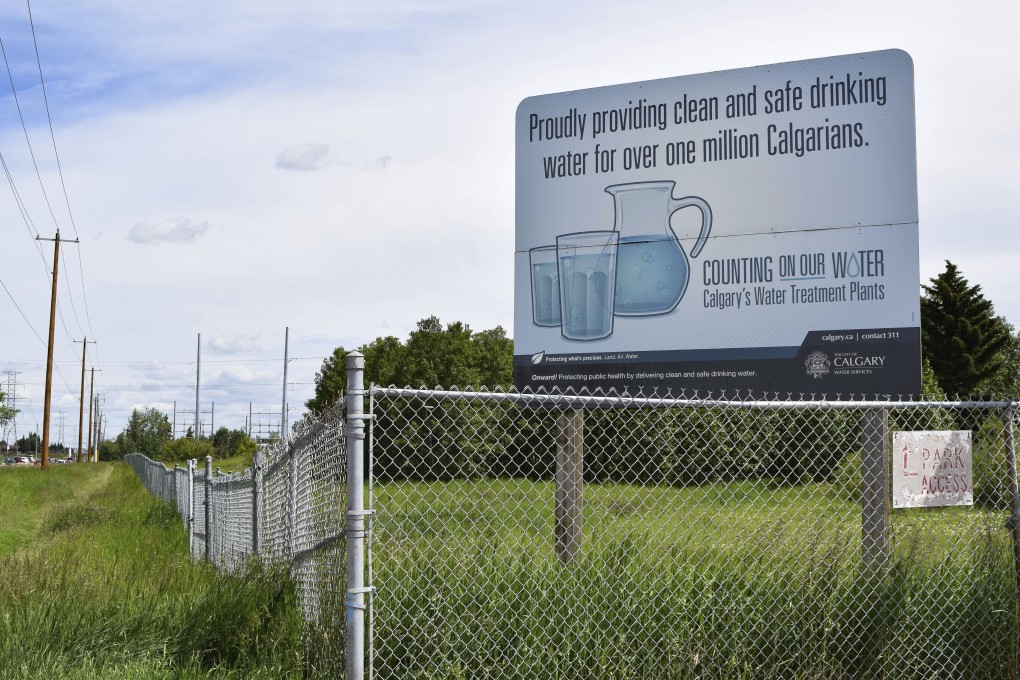 A sign outside the Glenmore Water Treatment Plant in Calgary, Alberta, in July. Drinking water in Canada can become contaminated as it travels from treatment plants to taps by passing through lead pipes. Photo: Institute for Investigative Journalism/Concordia University via AP