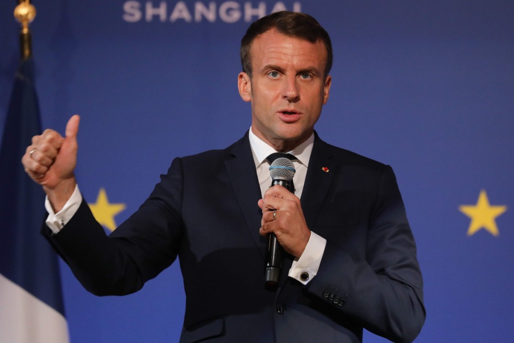 French President Emmanuel Macron addresses French and German businessmen during a meeting at a hotel before the China International Import Expo in Shanghai on Monday. Photo: AFP