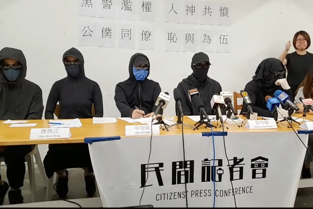 The masked men joined a group of protesters and two civil servants for a press conference on Monday. Photo: SCMP