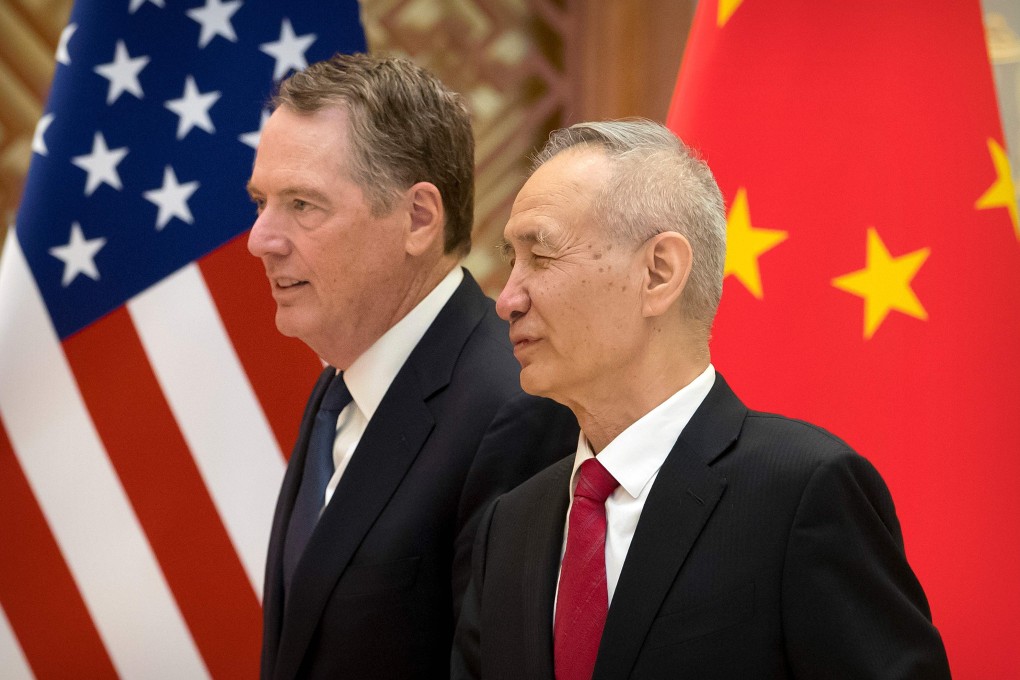 US Trade Representative Robert Lighthizer listens as Chinese Vice-Premier Liu He talks while they line up for a group photo at the Diaoyutai State Guesthouse in Beijing in February. Photo: AFP