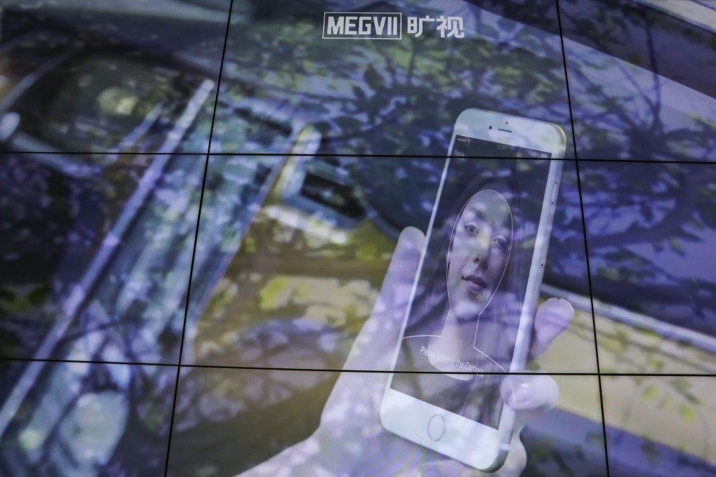 A big screen at Megvii Technology’s offices in Beijing shows the company’s facial recognition system used on a smartphone. Photo: Simon Song