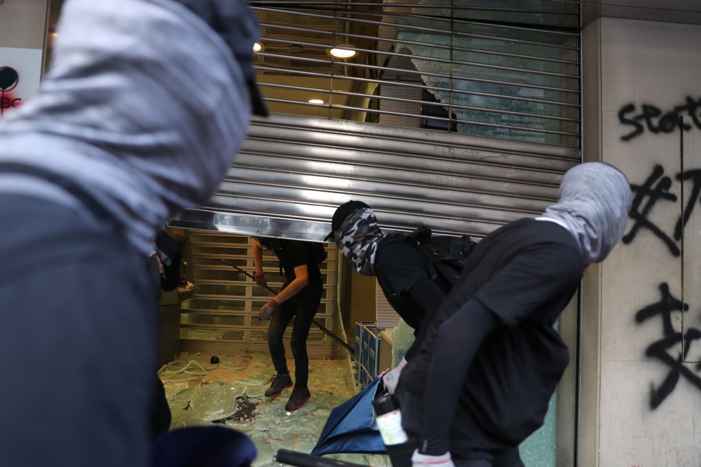 Anti-government protesters vandalise a ICBC bank branch on October 20 in Sham Shui Po. Photo: Sam Tsang