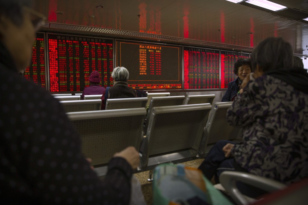 Chinese investors monitor stock prices at a brokerage house in Beijing on November 4, 2019. Photo: Associated Press