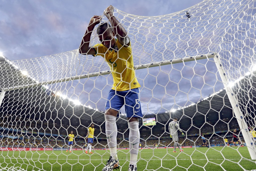 Brazil's Fernandinho reacts after Germany's Toni Kroos scores a third goal for Germany in their World Cup semi-final soccer match in Belo Horizonte, Brazil. Photo: AP