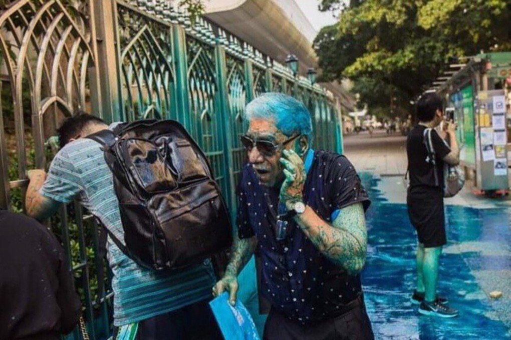 People outside Kowloon Mosque are covered in blue dye fired from a police water cannon during a protest in Hong Kong’s Tsim Sha Tsui district. Photo: Twitter
