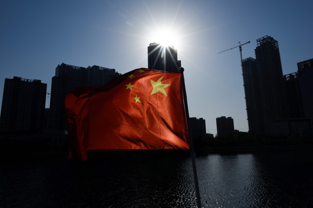 A Chinese national flag flutters on a boat in Beijing on October 29. A US-China trade deal will go some way towards restoring confidence in the Chinese economy, which would be key to mitigating the erosion of China’s long-term competitiveness. Photo: AFP
