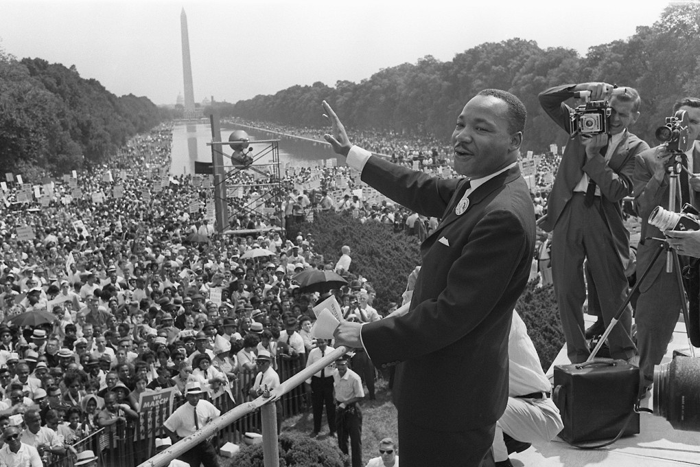 Civil rights leader Martin Luther King waves to supporters during the "March on Washington" on August 28, 1963. Photo: AFP